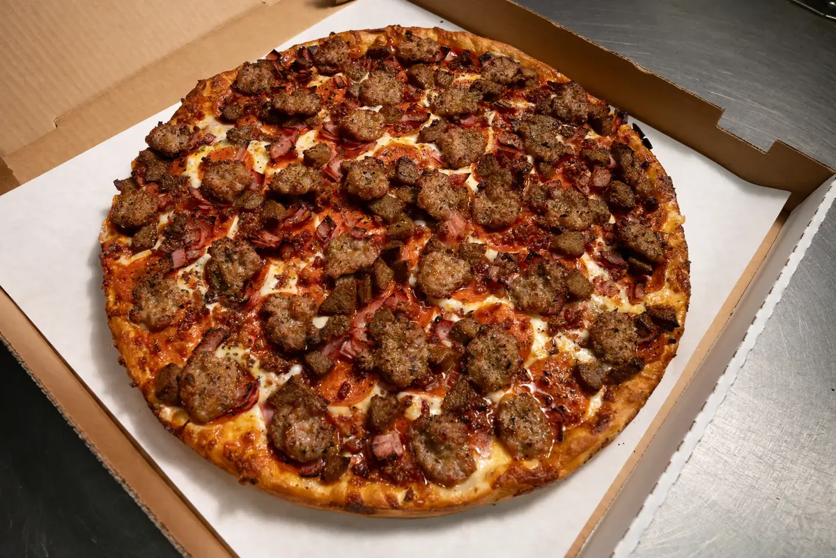 Mojo's Meat Lover's pizza, sliced